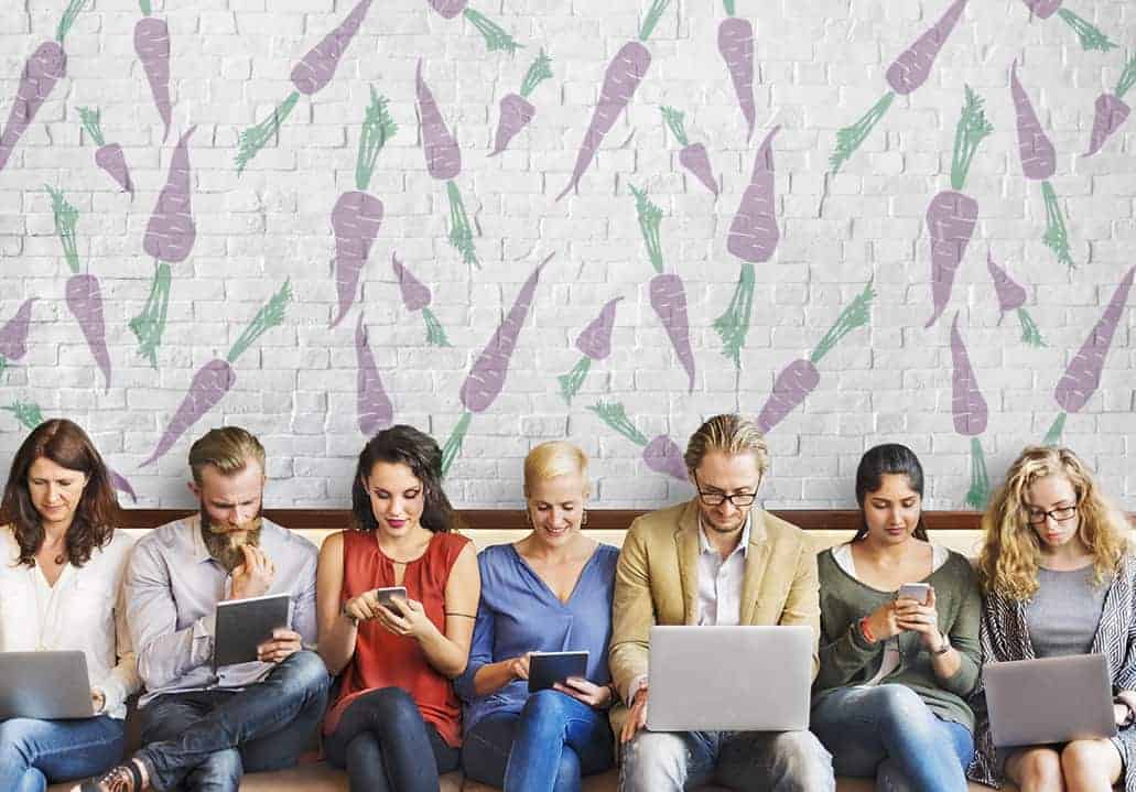 a group of people using different electronic devices